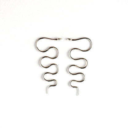 pair of silver wire snake hook earrings both sides view