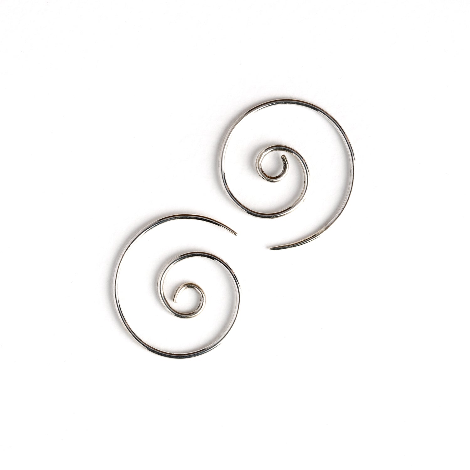pair of silver spiral wire earrings side view