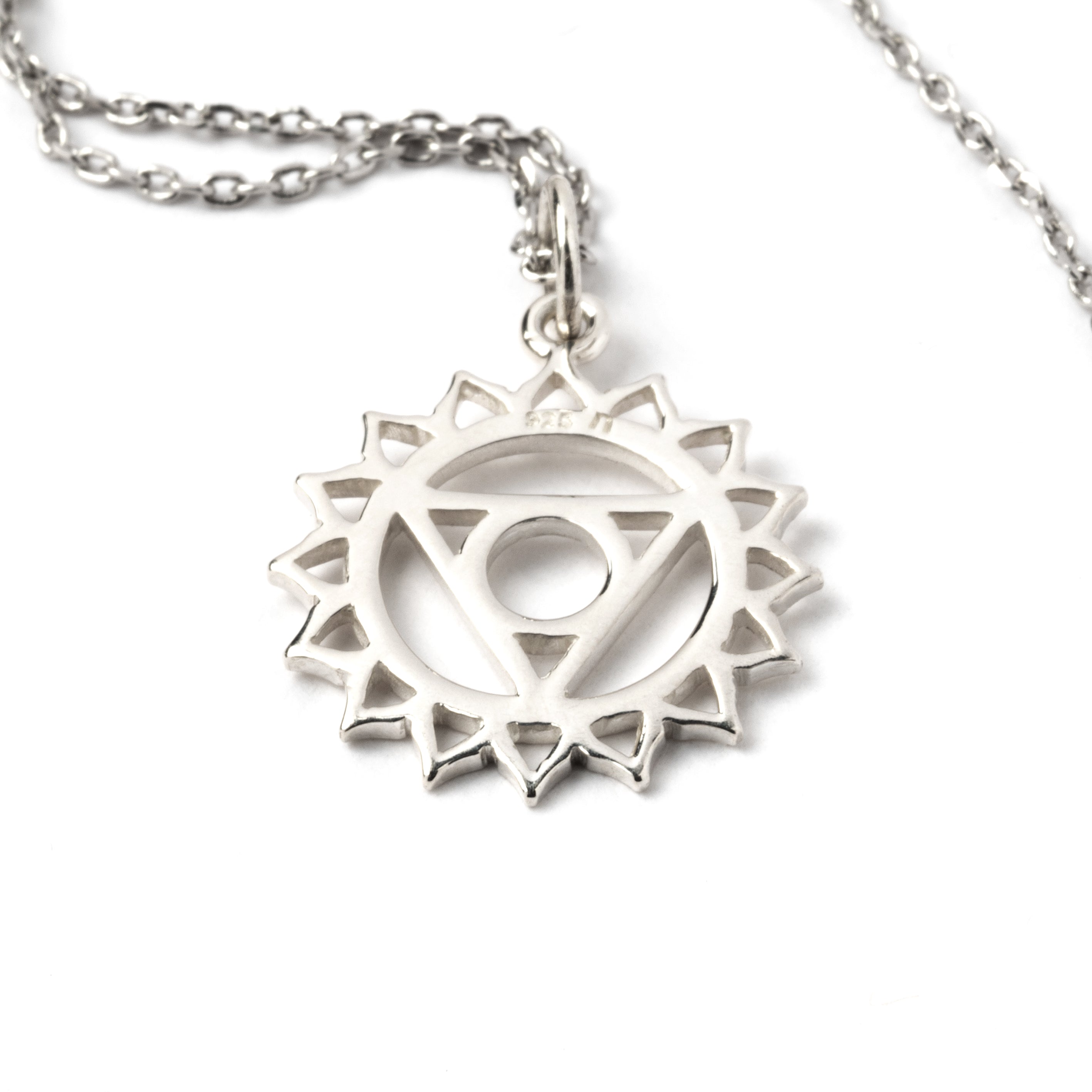 Sterling silver Throat Chakra charm necklace. The throat chakra is the fifth chakra out of seven in the body's energy system, recognised in yoga traditions and practices. This chakra reflects the aspects of self expression and communication.   This Chakra charm is part of the seven chakras pendents collection, please check out our necklaces category to see more chakra pendents.  Material: 925 sterling silver Dimensions : 22mm by 14mm Comes on a matching chain