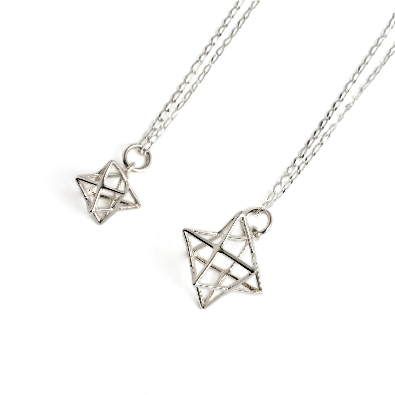 small and medium sizes Silver Wire Merkaba necklaces right side view
