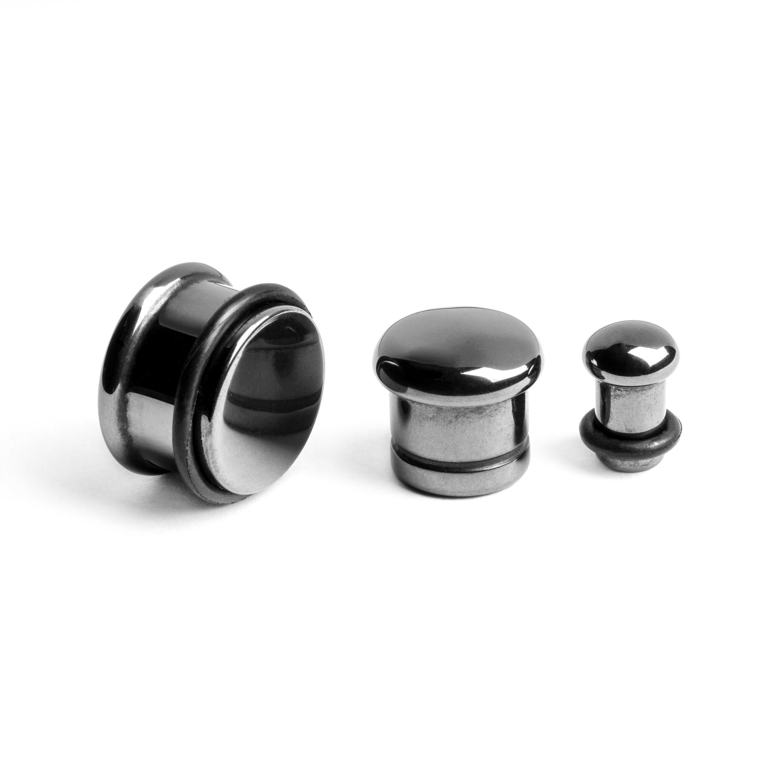 several sizes of Single Flared Hematite Stone Plugs front side and back view