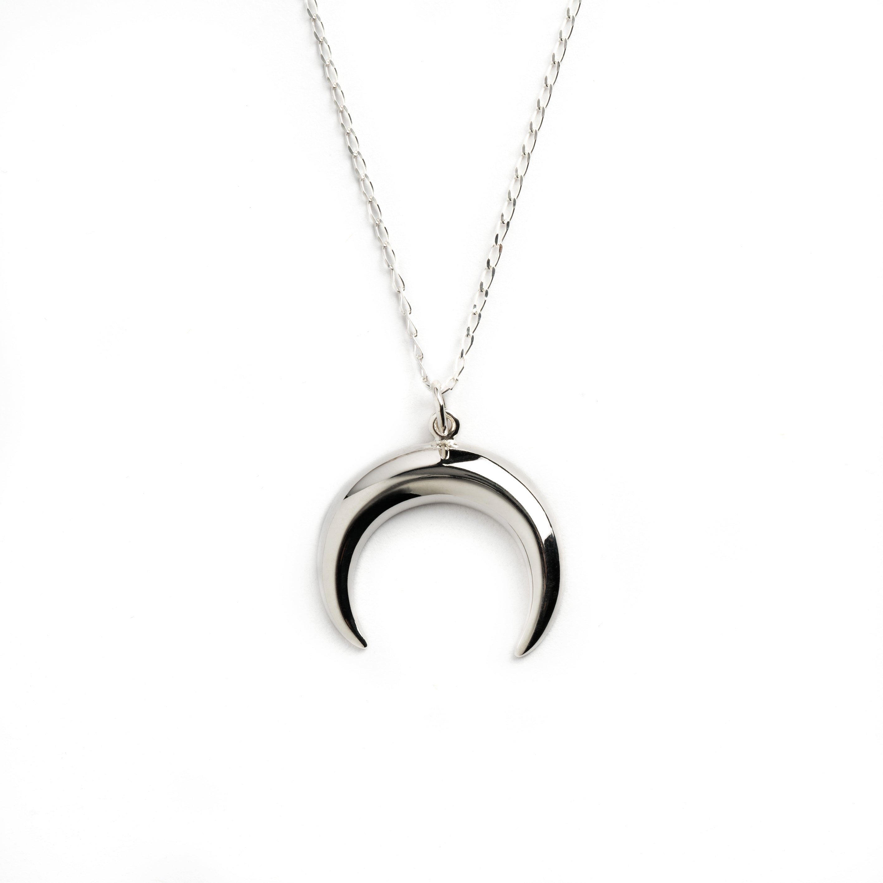 Silver crescent moon charm on a chain necklace frontal view
