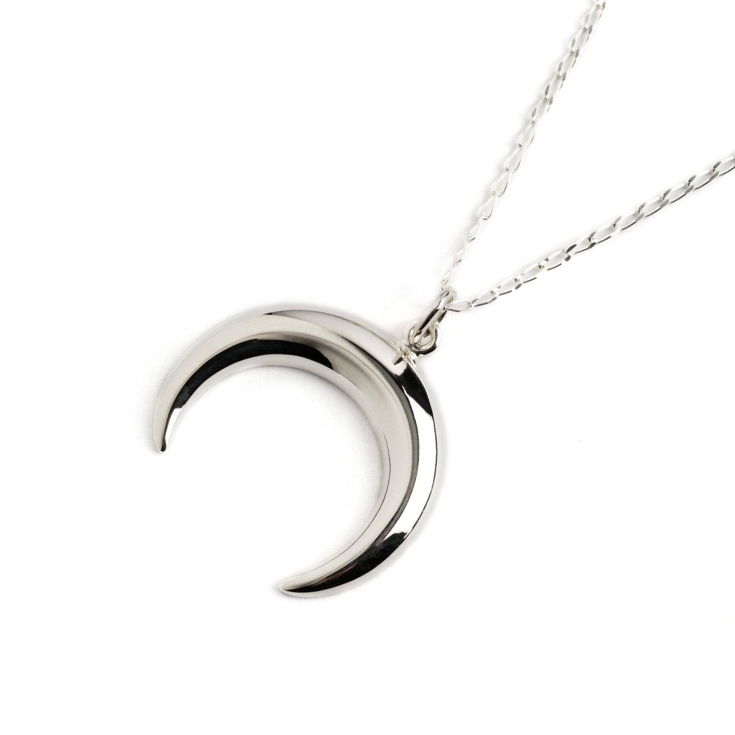Silver crescent moon charm on a chain necklace right side view