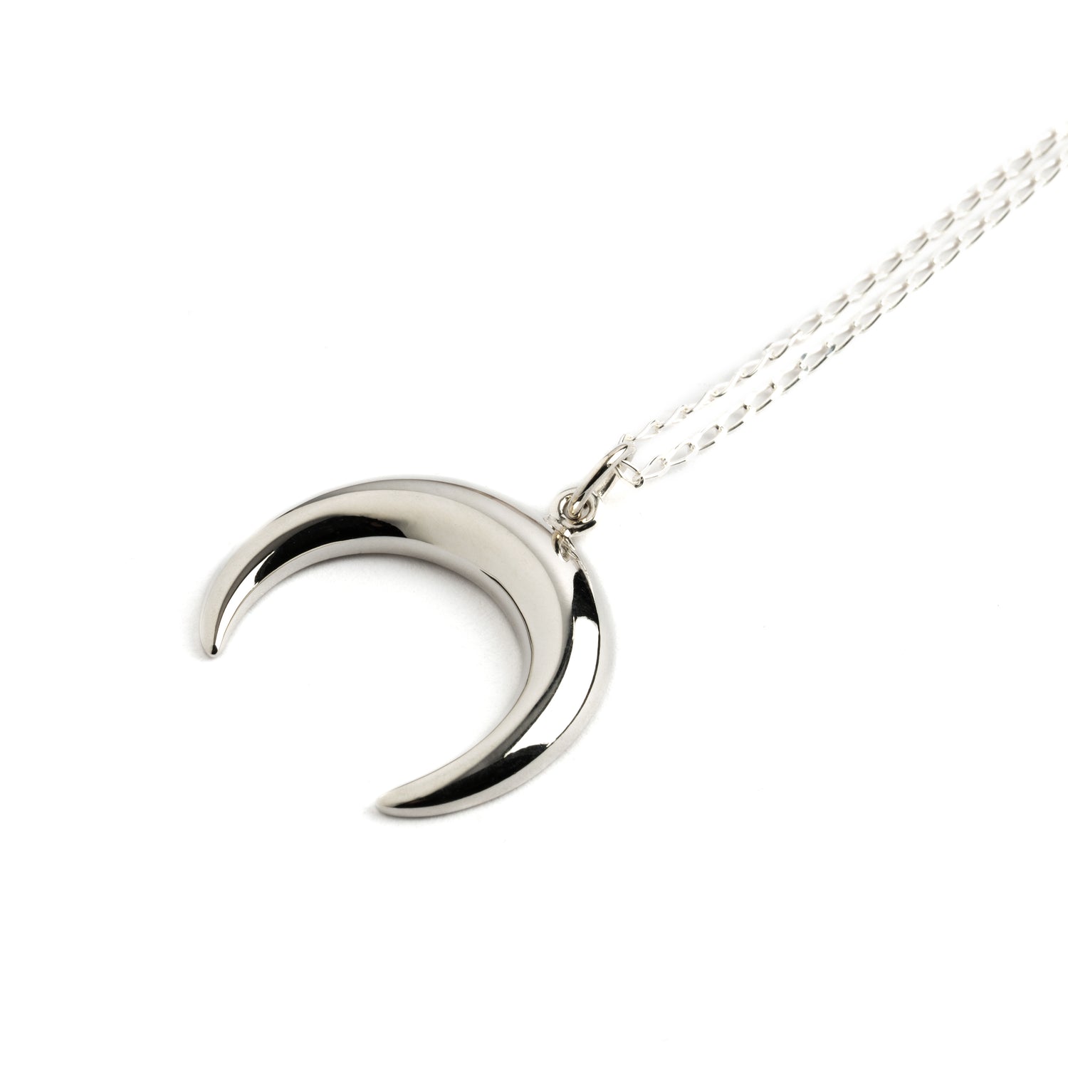 Silver crescent moon charm on a chain necklace right side view