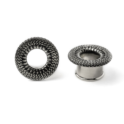Snakes skin texture silver plug tunnels frontal view