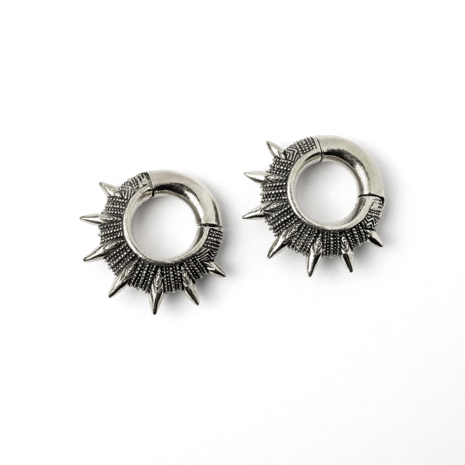 pair of silver colour spiky ear weights hoops left side view