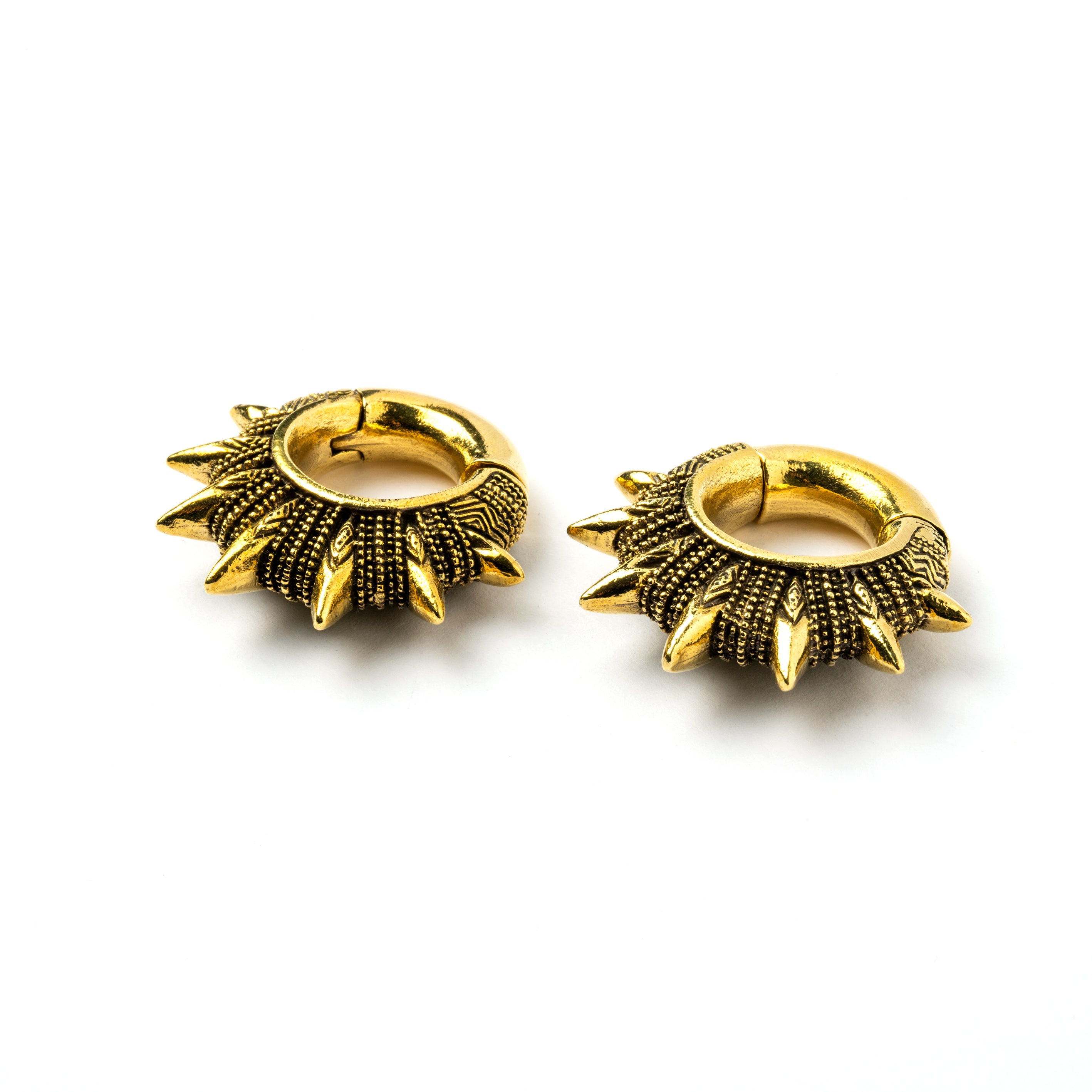 pair of golden spiky ear weights hoops down view