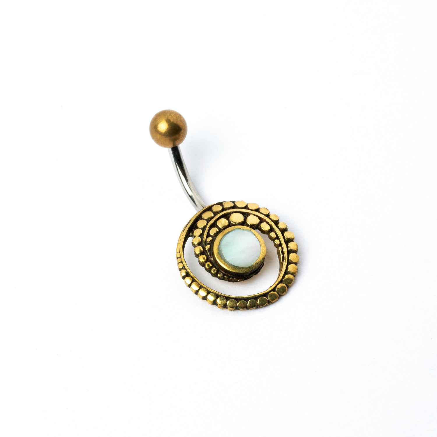 golden brass spiral belly piercing with mother of pearl shell left side view