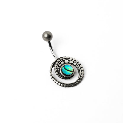 silver spiral belly piercing with Abalone shell left side view