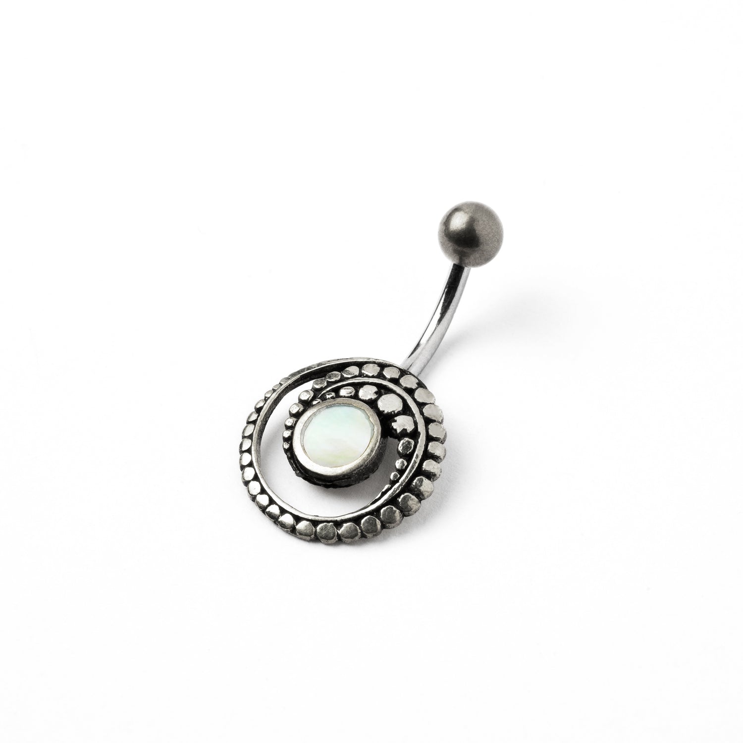 silver spiral belly piercing with mother of pearl shell right side view