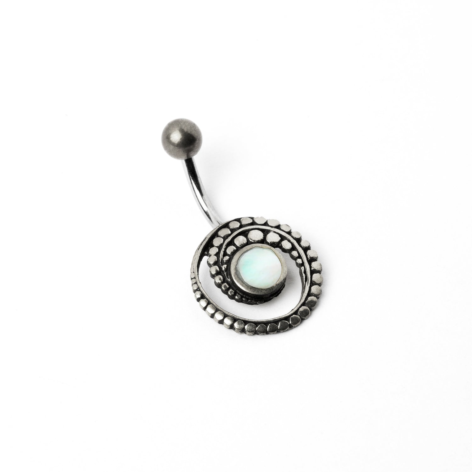 silver spiral belly piercing with mother of pearl shell left side view