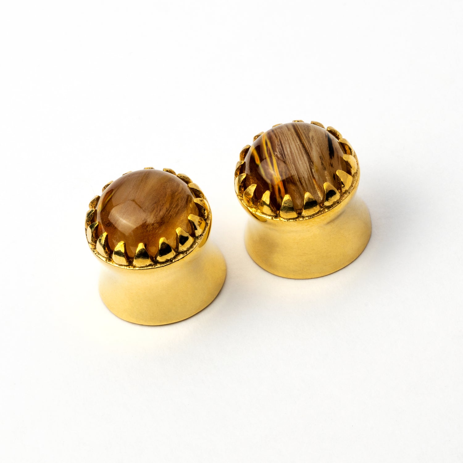 couple of golden plug earrings crown shaped with tiger eye glass