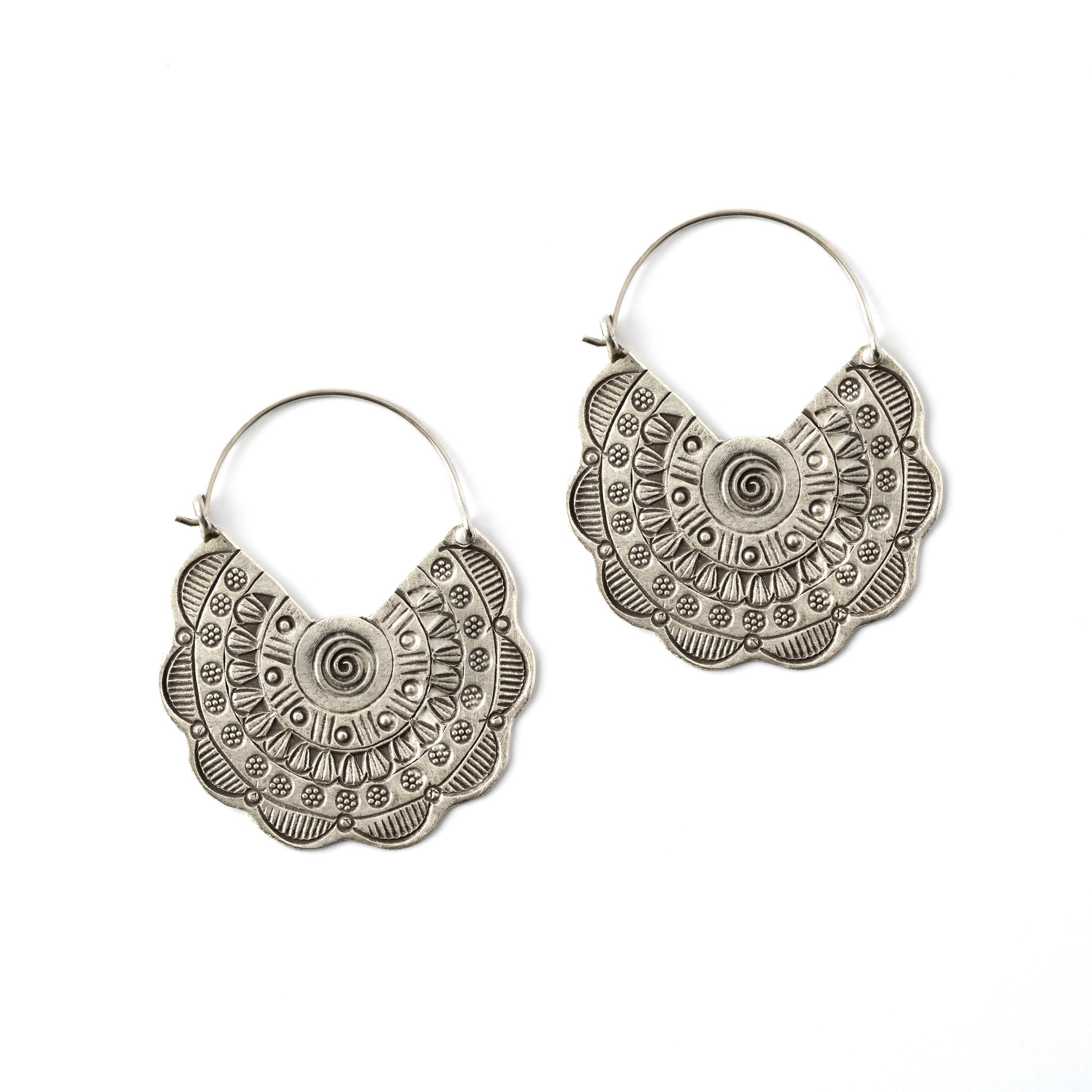 pair of flower disc silver earrings with tribal motifs stamps frontal view