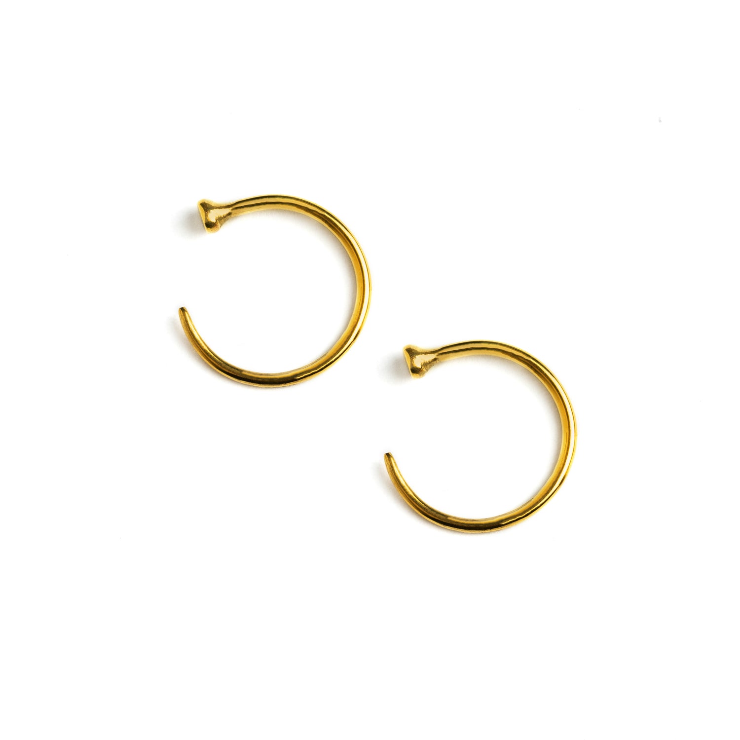 pair of open hoop golden brass wire earrings side view