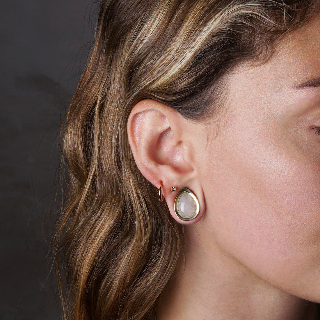 model wearing Teardrop Plugs with Rose Quartz