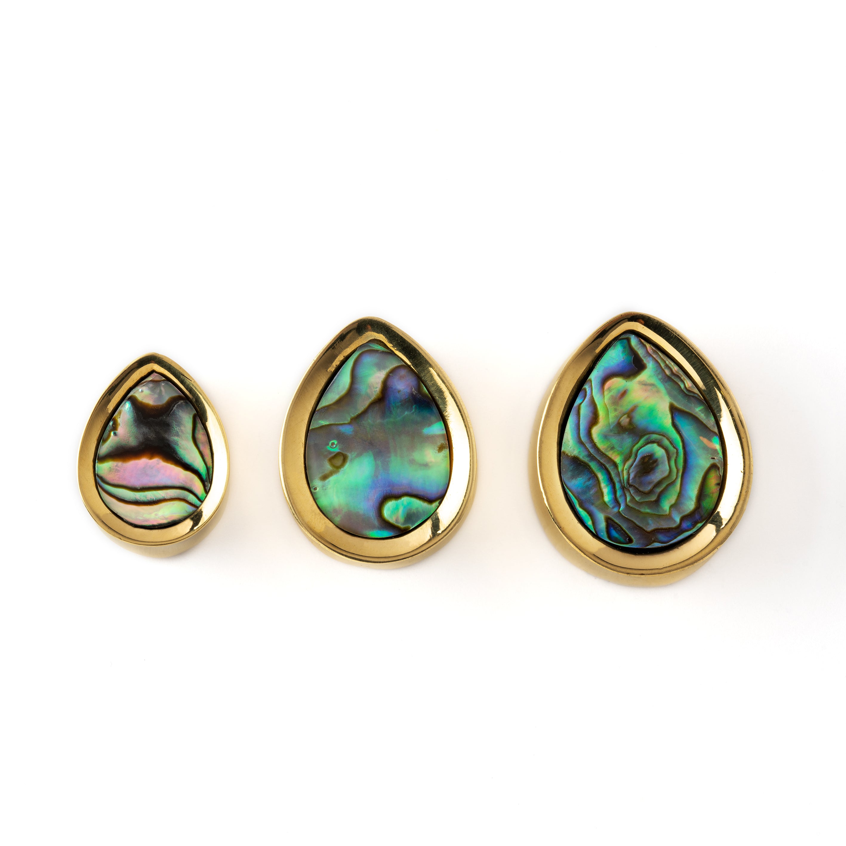 different sizes of golden teardrop shaped plug earrings with abalone shell inlay frontal view