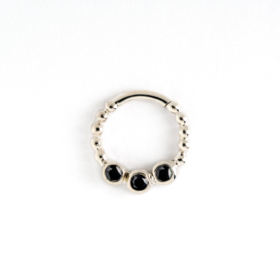 sterling silver dotted septum ring with three black spinel gemstones frontal view