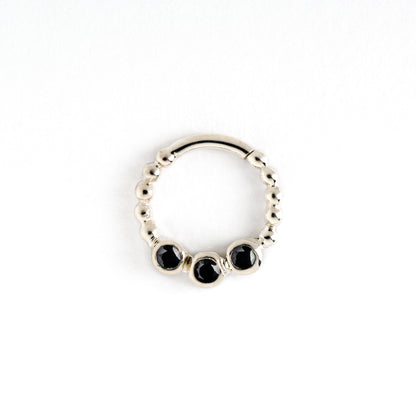 sterling silver dotted septum ring with three black spinel gemstones frontal view