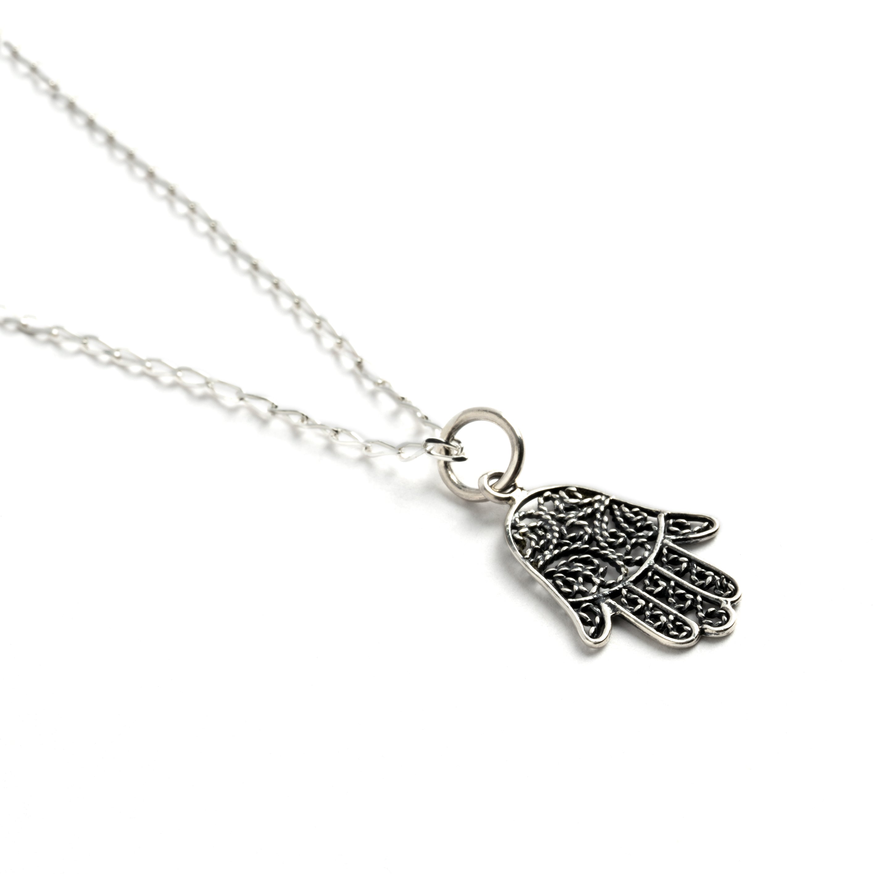 Tiny Silver Hamsa Charm necklace left side view