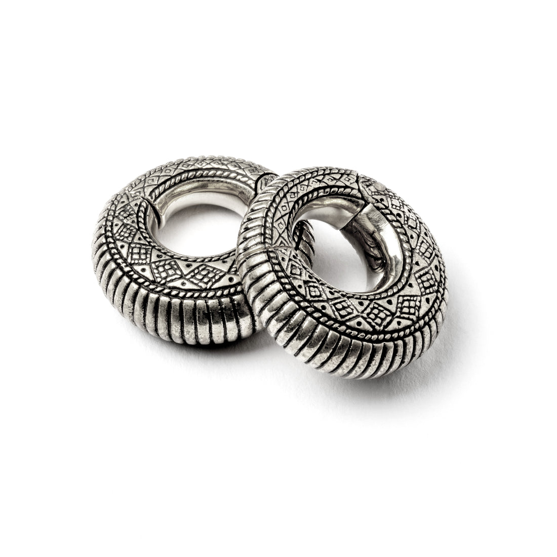 pair of silver brass ear weights hoops with geometric tribal engraved pattern 