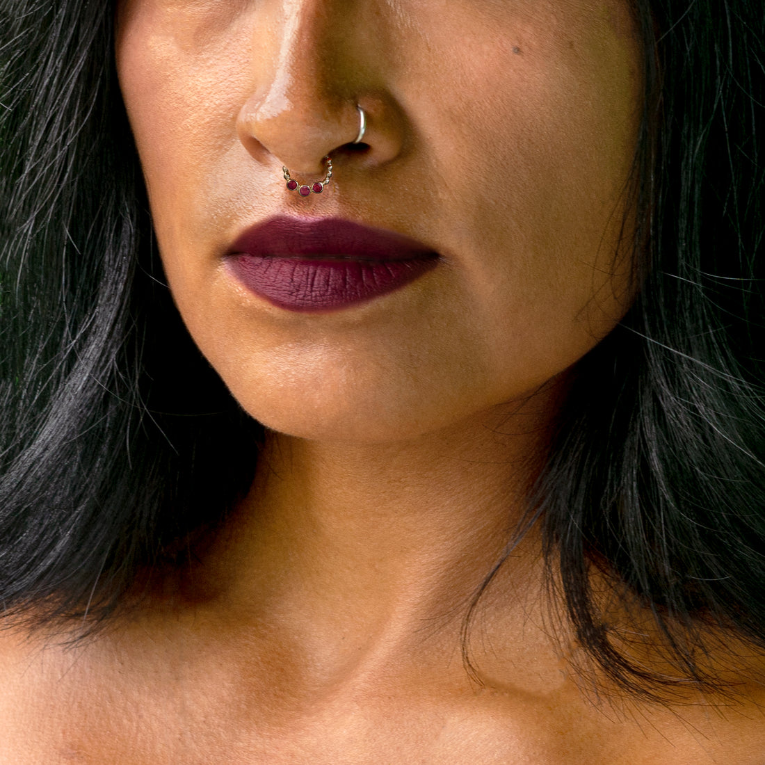 model wearing Trio Garnet Silver Septum