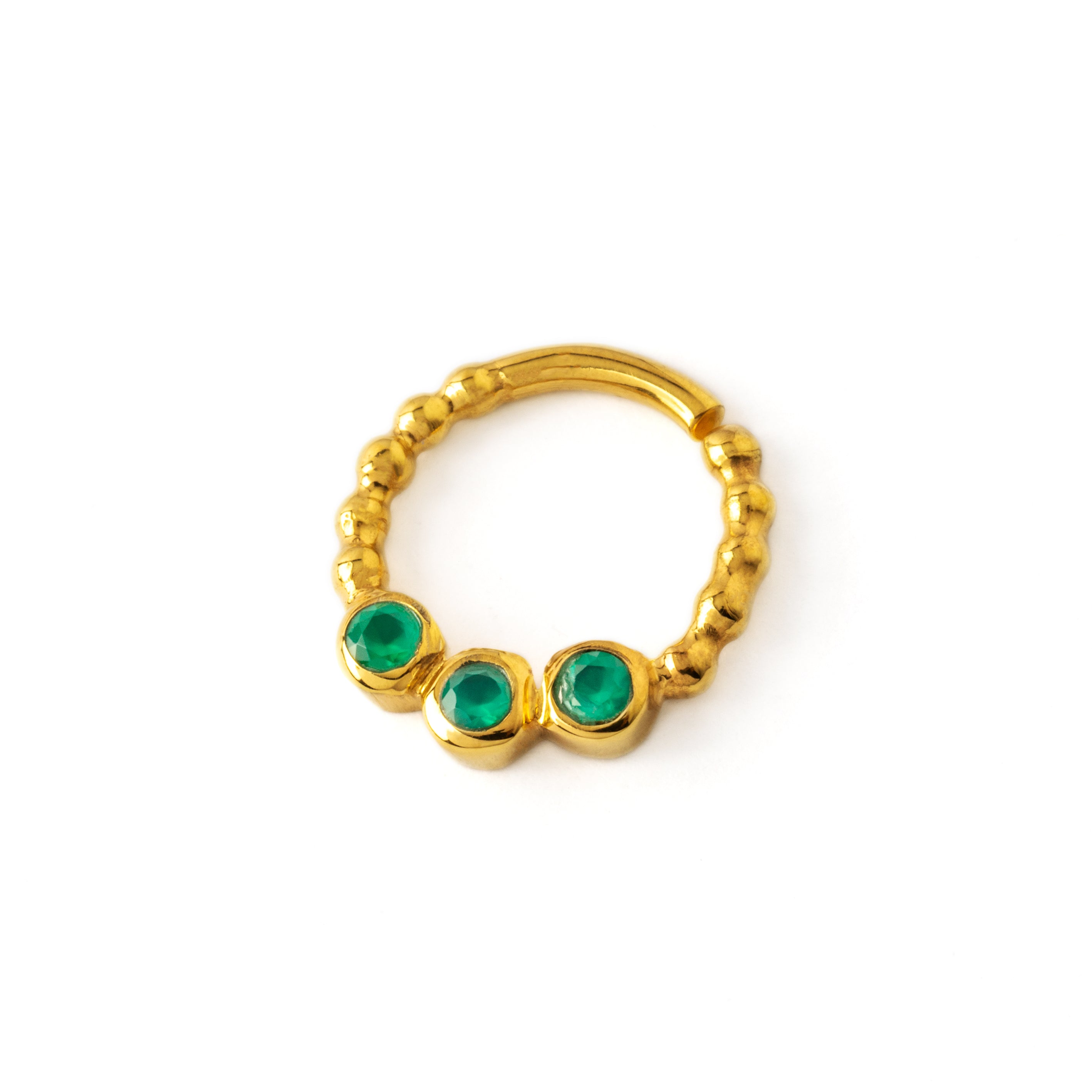 gold dotted septum ring with three Emerald gemstones right side view