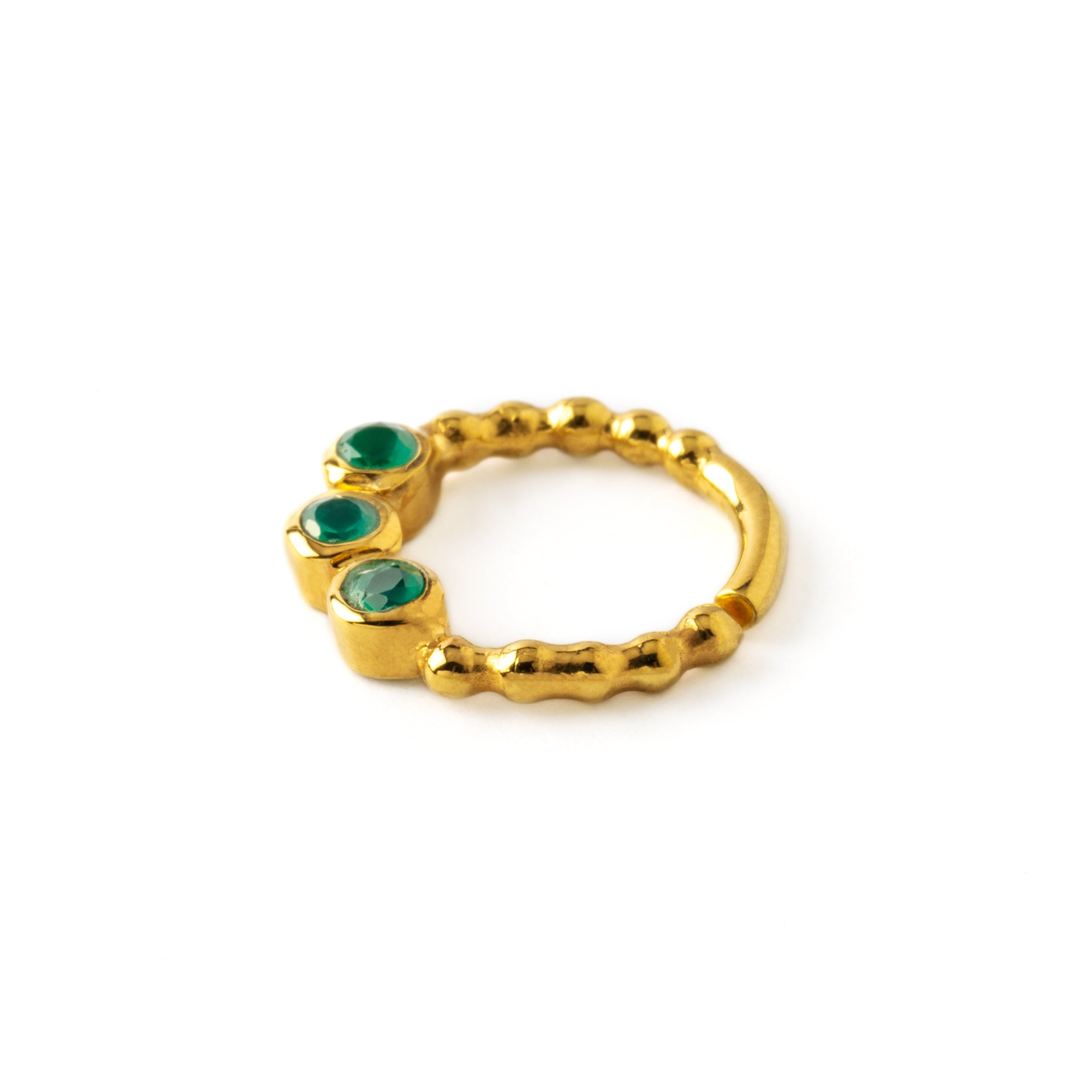 gold dotted septum ring with three Emerald gemstones side view
