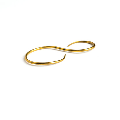 single swan shaped golden brass wire earrings left side view