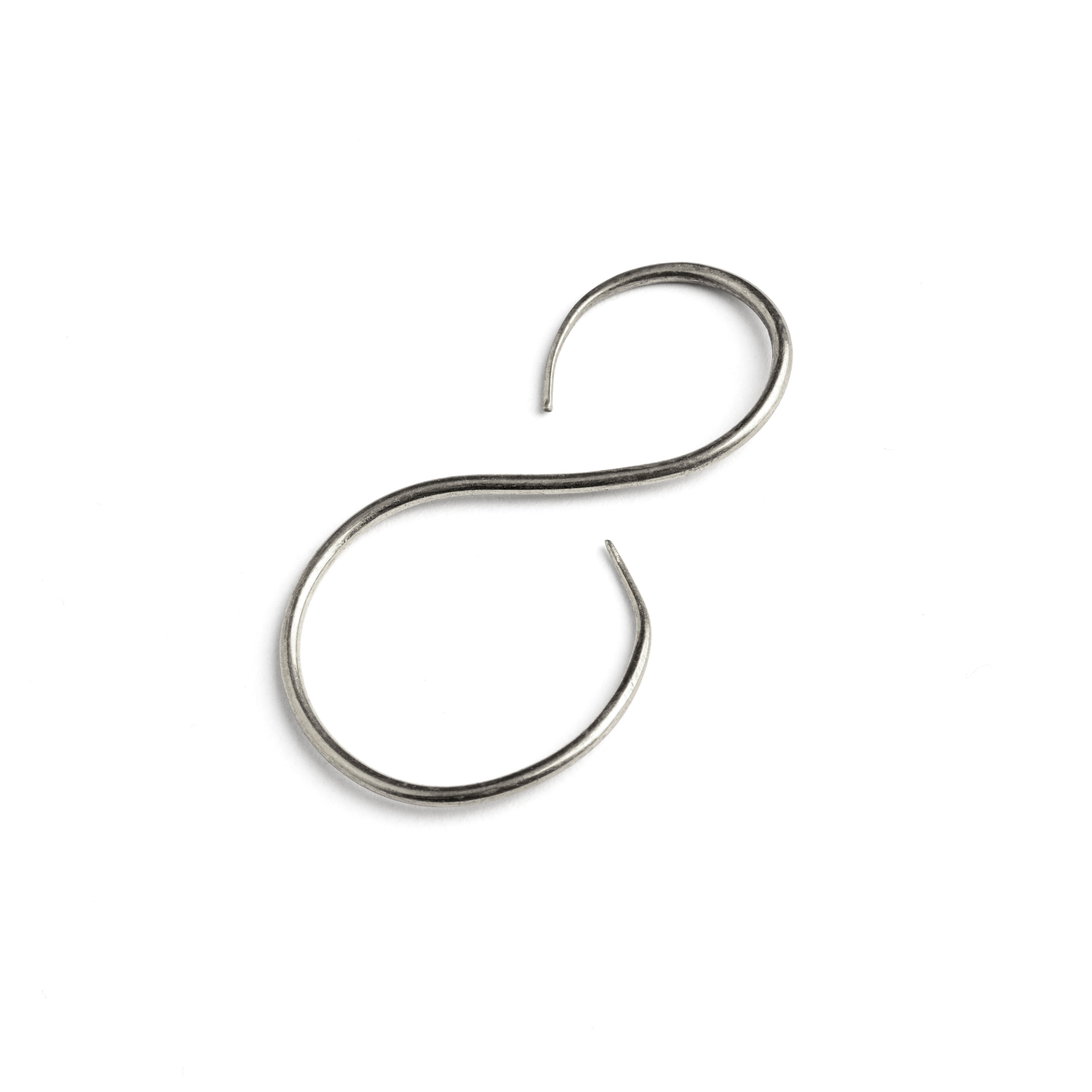 single swan shaped silver wire earrings side view
