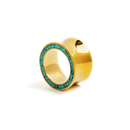 single golden brass with Turquoise ear plug left side view