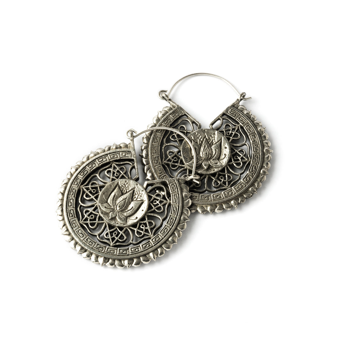 pair of white brass intricate carved lotus round earrings frontal view