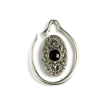 large ear weights hangers, silver colour oval shaped with intricate filigree pattern an black onyx front view