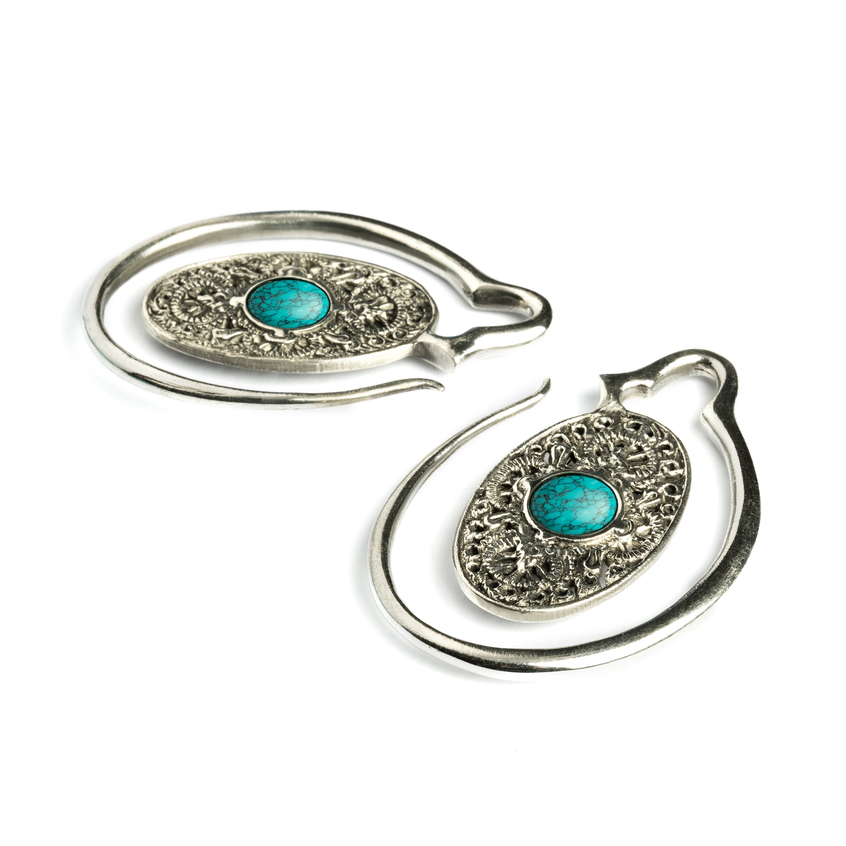 large ear weights hangers, silver colour oval shaped with intricate filigree pattern and turquoise down view