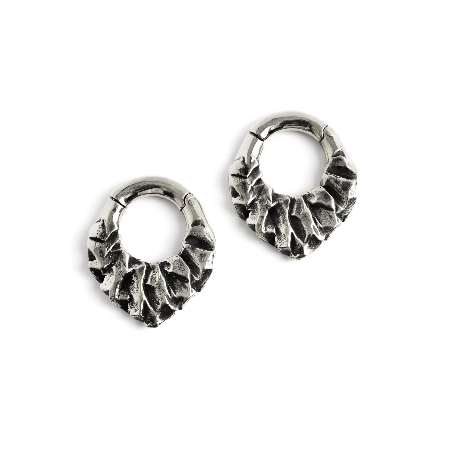 pair of silver brass teardrop shaped ear hoops hangers with rocky texture frontal view