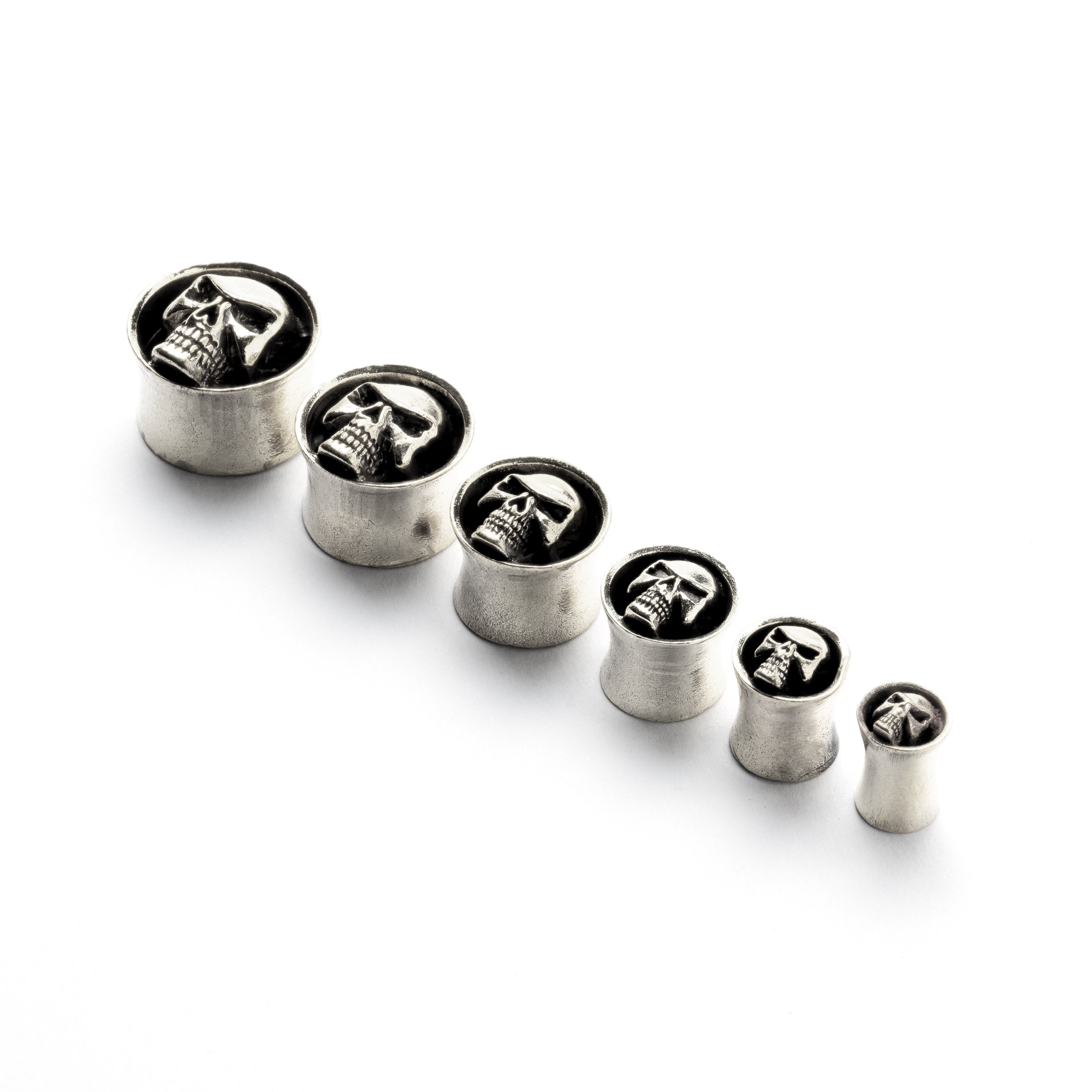 White brass skull ear plugs front view