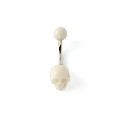 White skull navel piercing on a surgical steel bar frontal view