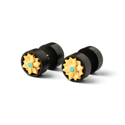 pair of wooden fake plugs earrings with carved flower and set turquoise right side view
