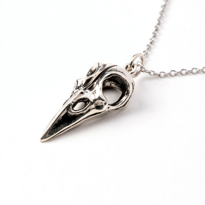 Silver raven skull necklace right side view