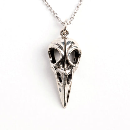 Silver raven skull necklace frontal view