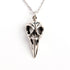 Silver raven skull necklace frontal view