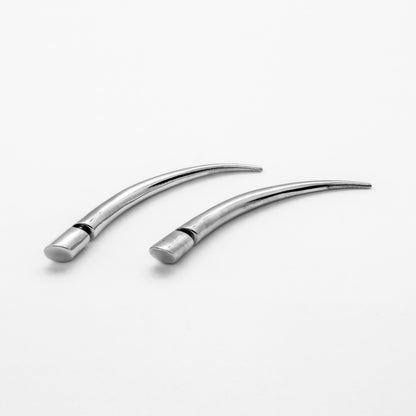 silver curved spike fake gauge earring close up view