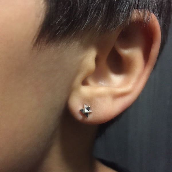 model wearing Silver Merkaba Ear Studs