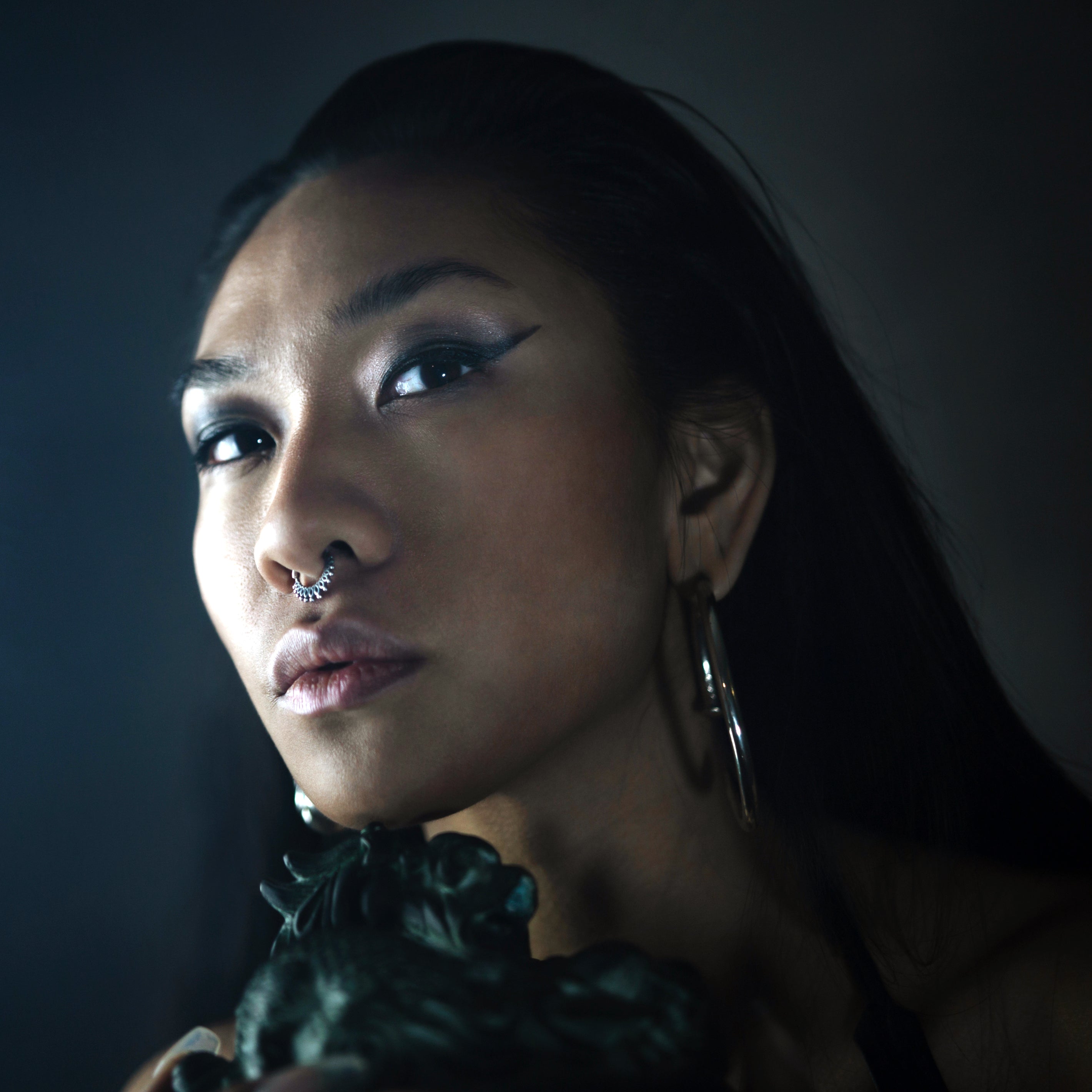 Sterling silver boho tribal septum ring ornamented with petals model shot