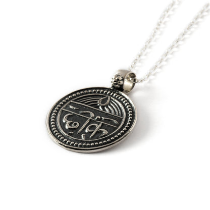 good health protection charm necklace made of oxidised silver macro view