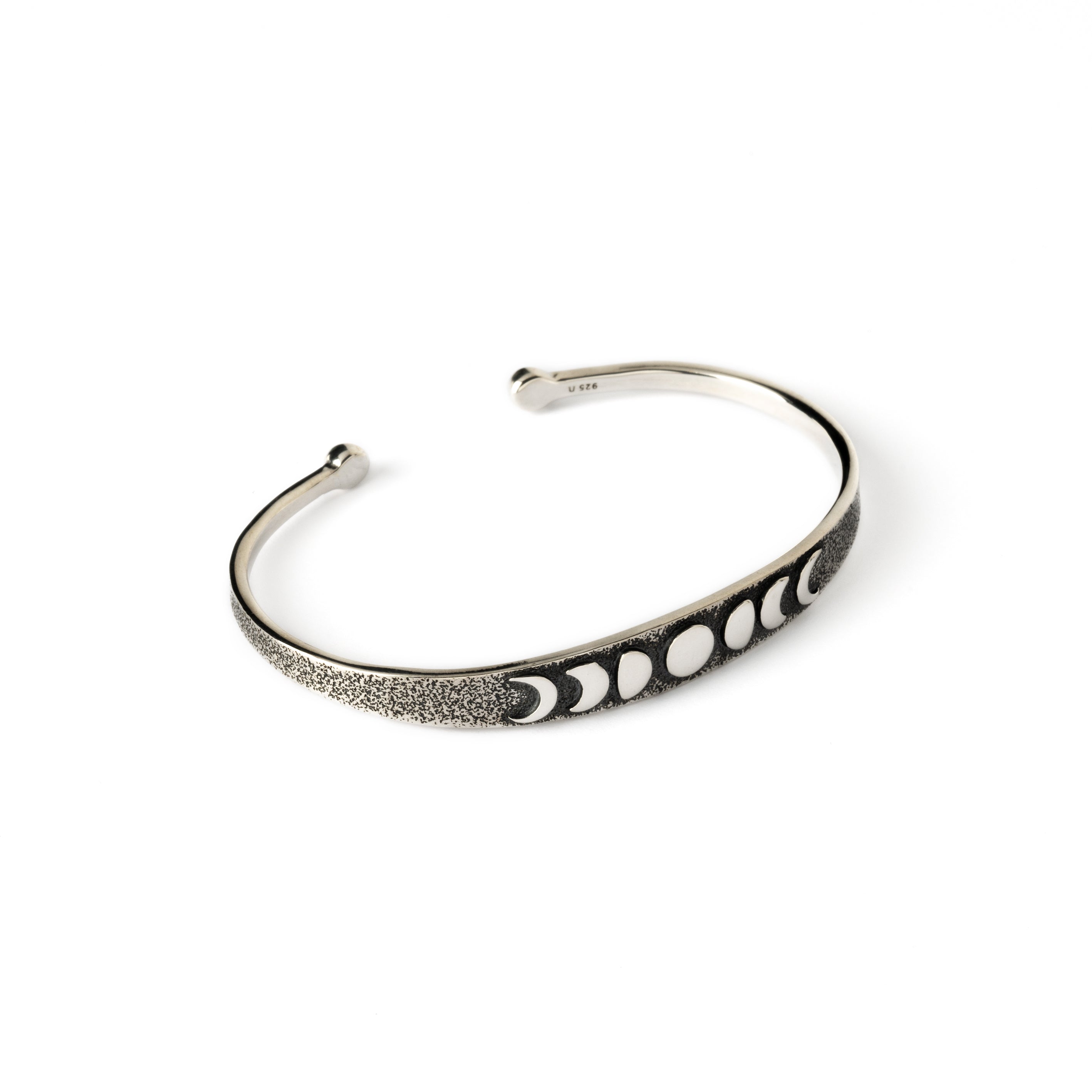 oxidised silver thin open bangle bracelet with embossed moon phases at the front side view