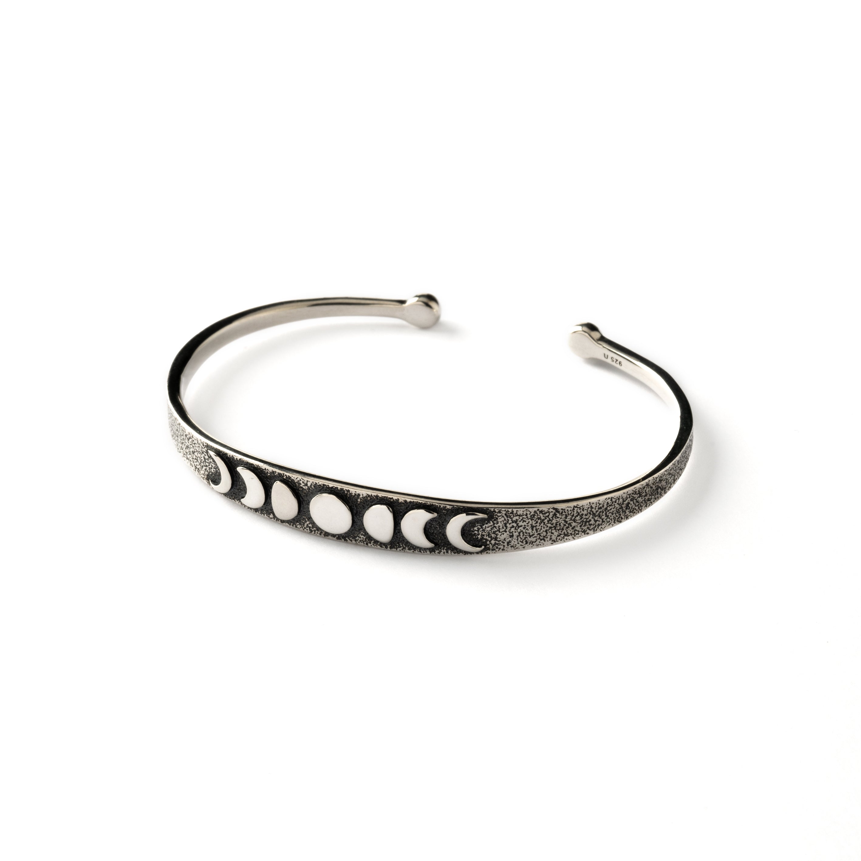 oxidised silver thin open bangle bracelet with embossed moon phases at the front