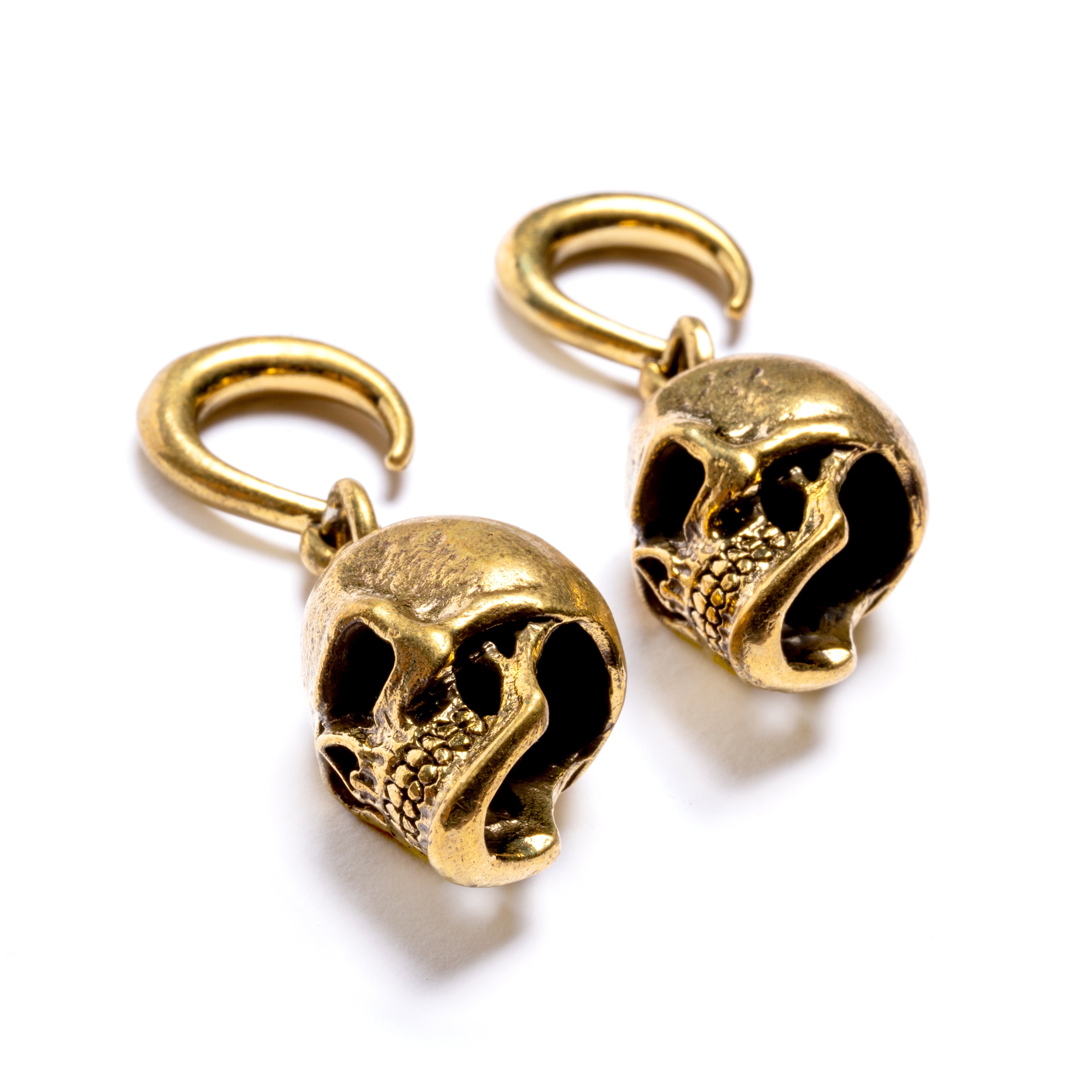 pair of gold brass skull hook ear weight hangers right side view