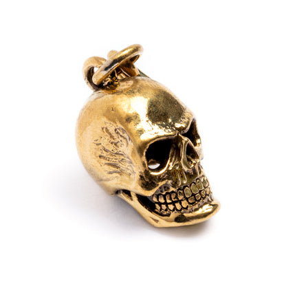 single gold brass skull hook ear weight hanger left front view