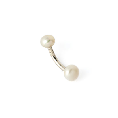 curved surgical steel navel bar with two white pearls, one at the top and a bigger one at the bottom
